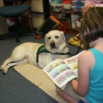 Girl Reading to Dog