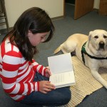 Girl Reading to Dog